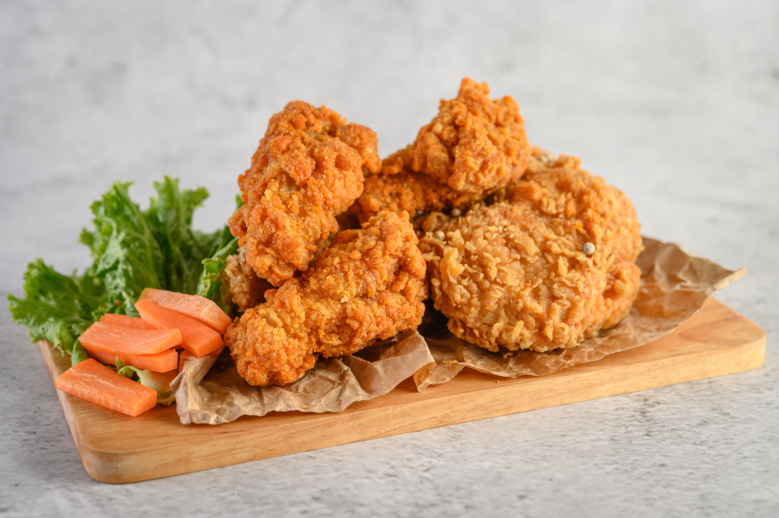 crispy fried chicken wooden cutting board